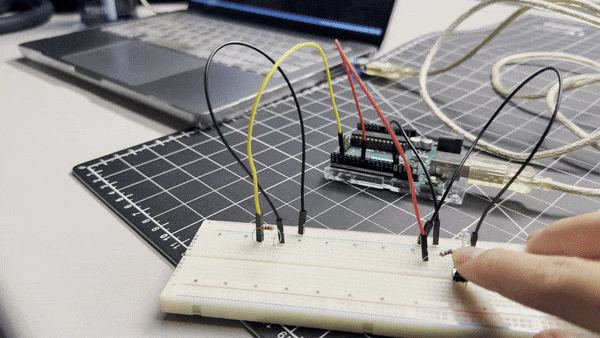 Testing button interaction. When the button is pressed, the LED on the breadboard lights up.